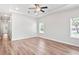 Spacious bedroom with wood flooring, recessed lighting, a ceiling fan, and large windows at 4568 18Th S Ave, St Petersburg, FL 33711