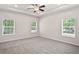 Bedroom featuring neutral carpet, recessed lighting, a ceiling fan, and multiple windows at 4568 18Th S Ave, St Petersburg, FL 33711