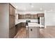Bright kitchen features stainless steel appliances, wood flooring, an island, and ample cabinet space at 4568 18Th S Ave, St Petersburg, FL 33711
