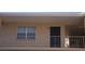 Exterior view of condo with secure front door, balcony and large window at 4724 Michael Ct # 122, Tampa, FL 33614