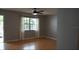 Spacious living room featuring wood-look flooring and a ceiling fan at 4724 Michael Ct # 122, Tampa, FL 33614