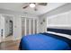Bright bedroom with a large closet and a bed with a blue comforter and plenty of natural light at 5298 Florentine Ct, Spring Hill, FL 34608