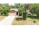 Charming single-story home featuring a stone facade, two-car garage, and a paved driveway at 5298 Florentine Ct, Spring Hill, FL 34608
