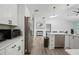 Bright open concept kitchen featuring an island with stainless steel appliances and generous counter space at 5298 Florentine Ct, Spring Hill, FL 34608