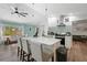 Open concept kitchen with an island, modern lighting, stainless steel appliances, and bar stool seating at 5298 Florentine Ct, Spring Hill, FL 34608