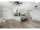 Open-concept kitchen with hardwood floors, a breakfast bar, and modern appliances at 5298 Florentine Ct, Spring Hill, FL 34608