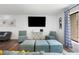 Bright living room with hardwood floors, natural light and modern seating at 5298 Florentine Ct, Spring Hill, FL 34608