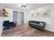 Comfortable living room with hardwood floors and tasteful wall art at 5298 Florentine Ct, Spring Hill, FL 34608