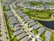 Aerial view of a residential community with lush landscaping, waterways, and well-maintained homes at 5548 Silver Sun Dr, Apollo Beach, FL 33572