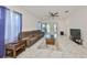 Cozy living room with a plush sectional, a ceiling fan, and sliding glass doors to the patio at 5548 Silver Sun Dr, Apollo Beach, FL 33572