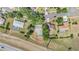 Aerial view of homes with lush landscaping, pools, and serene neighborhood streets at 6302 Silver Oaks Dr, Zephyrhills, FL 33542