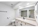 Bright bathroom with tiled flooring, large vanity, and a glass enclosed shower at 6302 Silver Oaks Dr, Zephyrhills, FL 33542