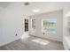 Bright bedroom with neutral walls, wood-look flooring, and views of the pool at 6302 Silver Oaks Dr, Zephyrhills, FL 33542