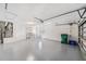 Spacious two-car garage provides ample storage, shelving and work space at 6302 Silver Oaks Dr, Zephyrhills, FL 33542