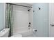 Bathroom featuring a white subway tiled shower with a new shower head and curtain at 6600 121St Ave # 4, Largo, FL 33773