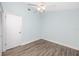 Clean and ready bedroom featuring new floors, neutral paint and fan with overhead lighting at 6600 121St Ave # 4, Largo, FL 33773