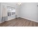 Bright bedroom with wood floors and natural light streaming through a large window at 6600 121St Ave # 4, Largo, FL 33773