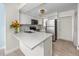 Modern kitchen with stainless steel appliances, white countertops, and a stylish backsplash at 6600 121St Ave # 4, Largo, FL 33773