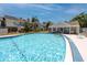 A community pool sits near residential buildings, with a cabana for shade and relaxation at 6600 121St Ave # 4, Largo, FL 33773