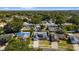 Aerial view of residence including pool, deck, backyard, and solar panels in St. Petersburg, FL at 7025 Orkney N Ave, St Petersburg, FL 33709