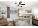 Comfortable bedroom with a ceiling fan, neutral decor, and inviting ambiance at 7025 Orkney N Ave, St Petersburg, FL 33709