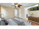 A beautifully staged bedroom with a ceiling fan and stylish decor at 7025 Orkney N Ave, St Petersburg, FL 33709