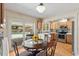 Charming dining area with pool view and a view to the kitchen at 7025 Orkney N Ave, St Petersburg, FL 33709