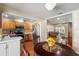 Kitchen boasts stainless steel appliances and wooden cabinetry, complemented by a round dining table at 7025 Orkney N Ave, St Petersburg, FL 33709