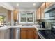 Well-lit kitchen with stainless steel appliances and ample counter space at 7025 Orkney N Ave, St Petersburg, FL 33709