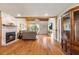 Spacious living room with a stone fireplace and wood beam ceiling at 7025 Orkney N Ave, St Petersburg, FL 33709