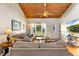 A well-lit living room showcasing hardwood floors, and a cozy seating area at 7025 Orkney N Ave, St Petersburg, FL 33709