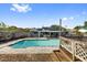 This amazing backyard features a sparkling pool, outdoor kitchen, beautiful home, and ample privacy at 7025 Orkney N Ave, St Petersburg, FL 33709