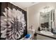 Bathroom featuring a decorative shower curtain, vanity with sink, and wall mirror at 8004 N Brooks St, Tampa, FL 33604