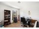 Bright bedroom featuring a bookshelf, desk, and natural light from the window at 8004 N Brooks St, Tampa, FL 33604