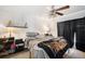 Comfortable bedroom with ceiling fan, room-darkening curtains, and simple décor at 8004 N Brooks St, Tampa, FL 33604