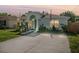 Charming single-story home with a well-manicured lawn, a wheelchair ramp and a welcoming arched entryway at 8004 N Brooks St, Tampa, FL 33604