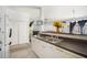 Efficient kitchen with modern amenities, open view to living areas, and stylish countertops at 8004 N Brooks St, Tampa, FL 33604
