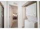Laundry area highlighting a stacked washer and dryer with a view into the other room at 8004 N Brooks St, Tampa, FL 33604