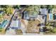 Aerial view showing the house, garages, pool, and surrounding yard at 9236 Suncoast Terrace, Hudson, FL 34667