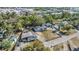 An aerial view of a house and lot with lots of trees surrounding the property at 9236 Suncoast Terrace, Hudson, FL 34667