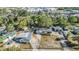 Aerial view of a home featuring multiple buildings, and mature landscaping at 9236 Suncoast Terrace, Hudson, FL 34667