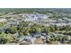 An aerial view of the property shows a large lot with a pool and surrounding industrial complexes at 9236 Suncoast Terrace, Hudson, FL 34667