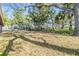 Large backyard with mature trees providing ample shade at 9236 Suncoast Terrace, Hudson, FL 34667