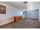 Cozy bedroom with neutral walls, plush carpeting, and a vintage dresser, offering comfortable living at 9236 Suncoast Terrace, Hudson, FL 34667
