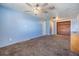 Spacious bedroom with light blue walls, plush carpeting, and a nice closet at 9236 Suncoast Terrace, Hudson, FL 34667