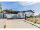 Single-story home with a covered area and a large driveway at 9236 Suncoast Terrace, Hudson, FL 34667