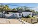 Single-story home with a covered area and a large driveway at 9236 Suncoast Terrace, Hudson, FL 34667