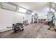 Garage featuring white walls, ceiling lights, and a work area at 9236 Suncoast Terrace, Hudson, FL 34667