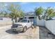 Garage with an auto lift and a car parked beside it at 9236 Suncoast Terrace, Hudson, FL 34667