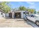 Garage with a concrete floor and a vehicle lift inside at 9236 Suncoast Terrace, Hudson, FL 34667